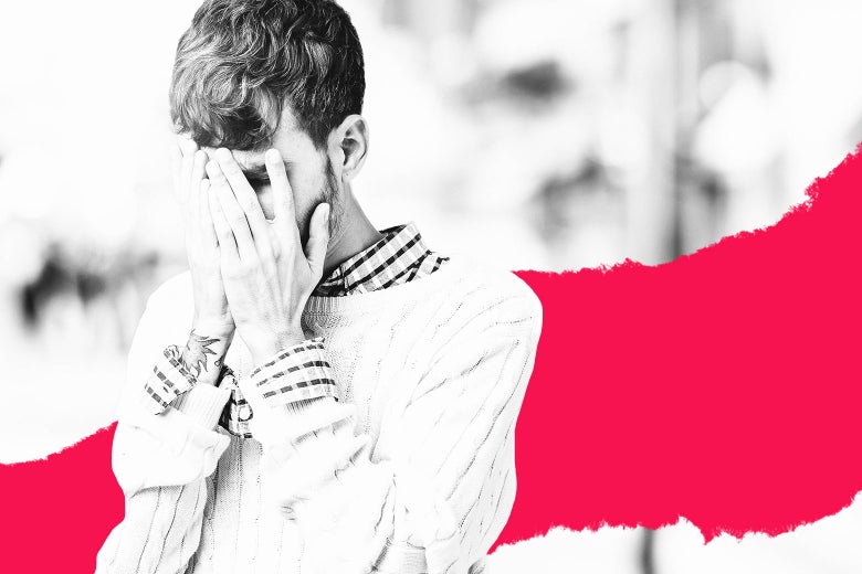 Man covering his face with his hands.
